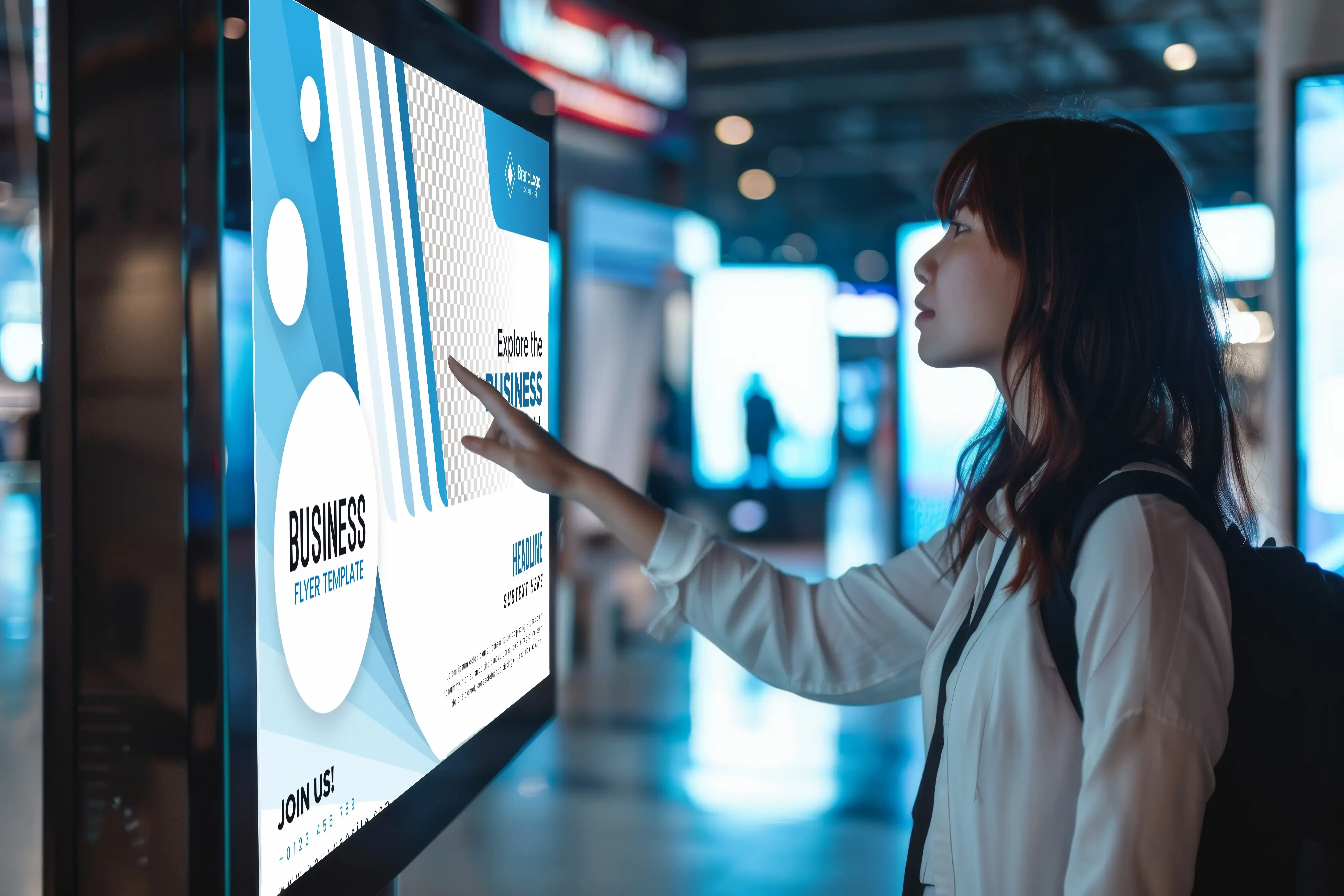 A girl touching an interactive display.
